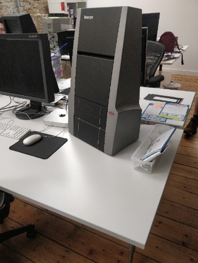 A computer tower on a desk

Description automatically generated with medium confidence